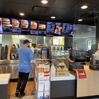 McDonald's - a man ordering food at a counter - Fast Food Near Me - Pacific, Missouri