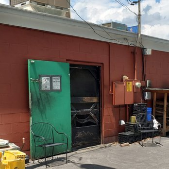 Henry's Smokehouse - Wood pile in back - Barbeque Near Me - Greenville, South Carolina