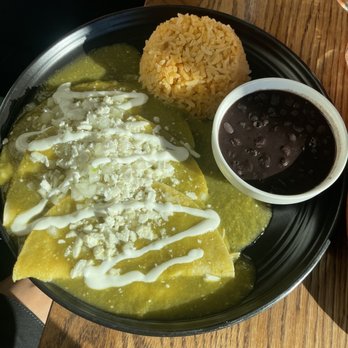 El Buen Comer - Chicken enchiladas topped with queso fresco, crema, with Spanish rice and smooth tasty black beans. - Mexican Near Me - San Francisco, California