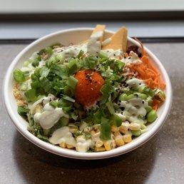 Torched Salmon poké - corn, carrots, edamame, tempura bits, green onion, tamgao, masago, torched salmon and wasabi mayo