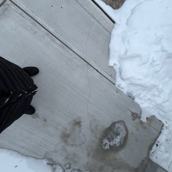 Maxxima Concrete - The crack goes all the way from the house to the driveway. - Masonry/Concrete Near Me Maxxima Concrete - The crack goes all the way from the house to the driveway. - Masonry/Concrete Near Me