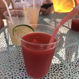 a drink in a plastic cup with a straw