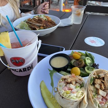 Sandbar - Buffalo chicken wrap and blackened chicken ceaser salad - New American Near Me - Clearwater Beach, Florida Sandbar - Buffalo chicken wrap and blackened chicken ceaser salad - New American Near Me - Clearwater Beach, Florida