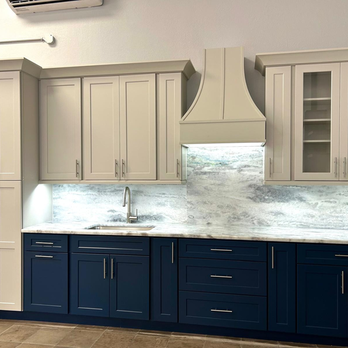 Countertops and More - Two-tone shaker cabinets paired with subtle granite backsplash in this elegant Naples build. - Countertop Installation Near Me - Naples, Florida Countertops and More - Two-tone shaker cabinets paired with subtle granite backsplash in this elegant Naples build. - Countertop Installation Near Me - Naples, Florida