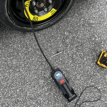 Halted Automotive Solutions - Putting air in customer flat spare tire - Roadside Assistance Near Me - East Point, Georgia