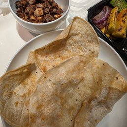 Dried up tortilla/corn, hard as a rock. Had to heat up my diced up kids meat separately
