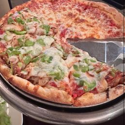 Half cheese, half green peppers and onion pizza Half cheese, half green peppers and onion pizza