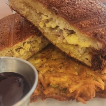 Billy Goat Grub - Stuffed French  toast ,with a gram cracker crust stuffed with sausage eggs and cheese, with latkes potatoes.  Berry jam, and syrup - Desserts Near Me - Norman, Oklahoma