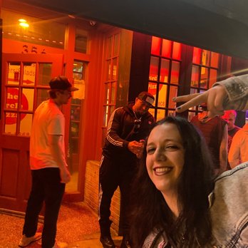 The Circle Tavern - a woman holding a knife in her hand - Bars Near Me - Boston, Massachusetts The Circle Tavern - a woman holding a knife in her hand - Bars Near Me - Boston, Massachusetts
