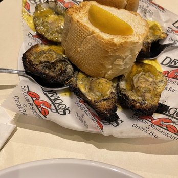 Drago's Seafood Restaurant at L'Auberge Lake Charles - 1/2 dozen charbroiled oysters- doused in butter, no seasoning, no cheese :/ - Seafood Near Me - Lake Charles, Louisiana Drago's Seafood Restaurant at L'Auberge Lake Charles - 1/2 dozen charbroiled oysters- doused in butter, no seasoning, no cheese :/ - Seafood Near Me - Lake Charles, Louisiana