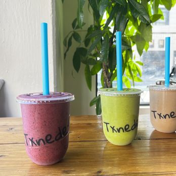 Txnedef Smoothies - Took a pic of the ones I tried.  Left to right: Berry Wetness, Green Man-Go, Sahara Sunrise. - Juice Bars & Smoothies Near Me