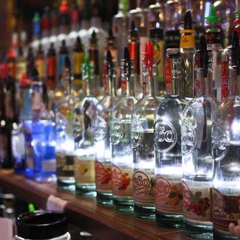 Sundance Lounge - a row of liquor bottles on a bar - Dance Clubs Near Me - Gillette, Wyoming Sundance Lounge - a row of liquor bottles on a bar - Dance Clubs Near Me - Gillette, Wyoming