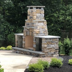 Eaise Design & Landscaping - Custom fireplace & landscaping.