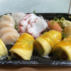 Scallop sashimi, octopus sashimi, smoked salmon sushi, and a roll with mango (I don't recall the name. Sorry.)