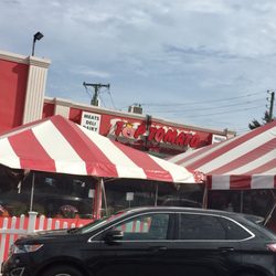 Top Tomato - The storefront with large tents for produce outside from spring to fall.
