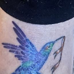 This is my latest foot tattoo. It's a beautiful hummingbird holding an orange ribbon as a symbol of kidney cancer. I'm a survivor! This is my latest foot tattoo. It's a beautiful hummingbird holding an orange ribbon as a symbol of kidney cancer. I'm a survivor!