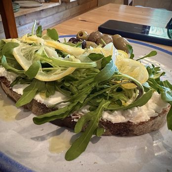 Paonia Bread Works - Lemon ricotta and arugula toast - Coffee & Tea Near Me - Paonia, Colorado Paonia Bread Works - Lemon ricotta and arugula toast - Coffee & Tea Near Me - Paonia, Colorado
