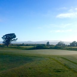 True Links Style - scarce trees, constant rolling terrain, big and fast greens.