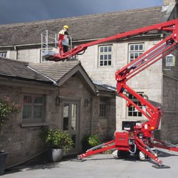 Timber Works Tree Care - Spider lift next to a house!