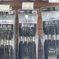 Elegant Beauty Supplies - The sign says $43.99. At the register they added $12 additional dollars. Per pack of hair.