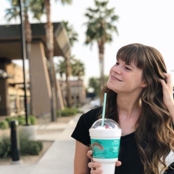 Bahama Buck's - a woman holding a starbucks cup - Desserts Near Me - Mesa, Arizona