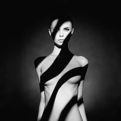 George Mayer Studio - Art nude. A figure without clothes, with an original shadow pattern on the body. Shooting price from $900
