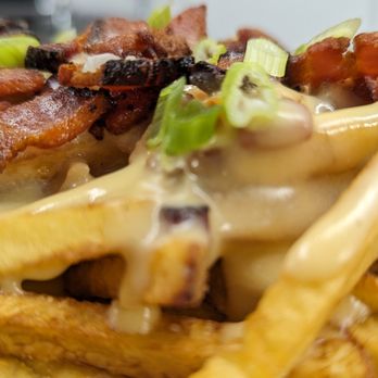 Smothered Goose - a plate of fries with bacon and cheese - Barbeque Near Me - International Falls, Minnesota Smothered Goose - a plate of fries with bacon and cheese - Barbeque Near Me - International Falls, Minnesota