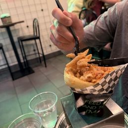Penne ala vodka with shrimp in a bread cone. Penne ala vodka with shrimp in a bread cone.