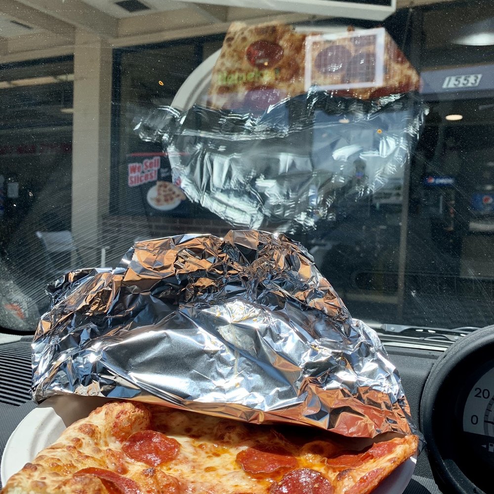 Parked right out front. Already took a bite. I always gotta try the crust first whenever I try a new pizza.