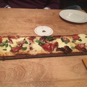 Seasons 52 - Roma flatbread with sun dried tomatoes and basil - New American Near Me - Mclean, Virginia Seasons 52 - Roma flatbread with sun dried tomatoes and basil - New American Near Me - Mclean, Virginia