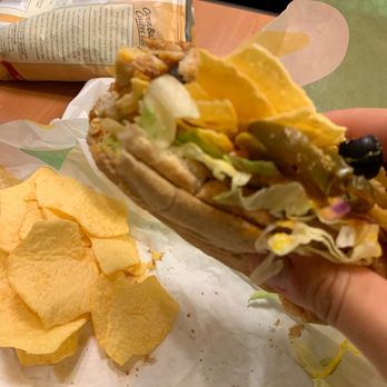 Subway - a hand holding a sandwich and chips - Sandwiches Near Me - Toronto, Ontario Subway - a hand holding a sandwich and chips - Sandwiches Near Me - Toronto, Ontario