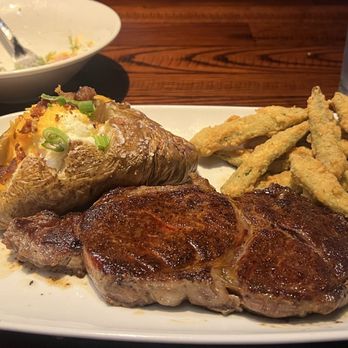 LongHorn Steakhouse - Ribeye with a Loaded Baked Potato and Crispy Texas Okra - Steakhouses Near Me - Houston, Texas LongHorn Steakhouse - Ribeye with a Loaded Baked Potato and Crispy Texas Okra - Steakhouses Near Me - Houston, Texas