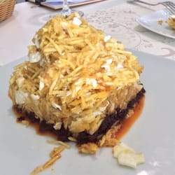 Acro - Ración de Huevos rotos con bacalao y morcilla (mondonga)