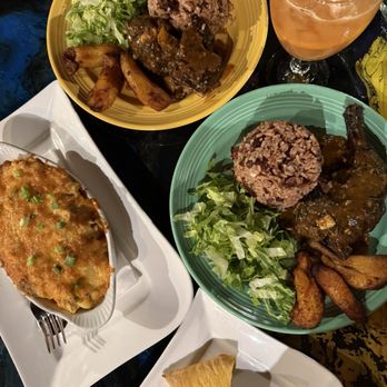 Art Table - Oxtail Mac & Cheese, Jamaican Patties, jerk chicken, braised oxtail and guava lemonade - Wine Bars Near Me - Seattle, Washington Art Table - Oxtail Mac & Cheese, Jamaican Patties, jerk chicken, braised oxtail and guava lemonade - Wine Bars Near Me - Seattle, Washington