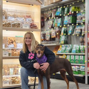 Buchheit - a woman and her dog in a store - Sports Clubs Near Me - Jacksonville, Illinois Buchheit - a woman and her dog in a store - Sports Clubs Near Me - Jacksonville, Illinois