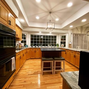 ProMasters Contracting - a large kitchen with hardwood floors - General Contractors Near Me ProMasters Contracting - a large kitchen with hardwood floors - General Contractors Near Me