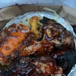 a plate of ribs, ribs, and potatoes a plate of ribs, ribs, and potatoes