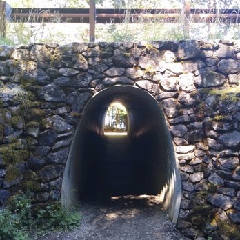 Marymere Falls - Tunnel on the trail to walk through to reach the falls - Hiking Near Me - Port Angeles, Washington Marymere Falls - Tunnel on the trail to walk through to reach the falls - Hiking Near Me - Port Angeles, Washington