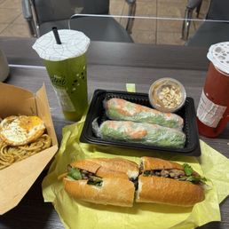 The shrimp spring rolls with peanut butter sauce garlic noodles with a fried eggs, the lemongrass pork banh mi!