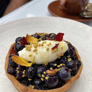 A16 - a blueberry tart and a cup of coffee - Italian Near Me - Oakland, California