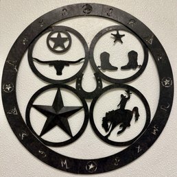 a circular metal sign with a cowboy theme a circular metal sign with a cowboy theme