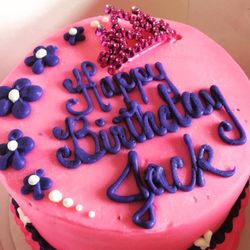The SweetSpot Bakehouse - Small round princess birthday cake with pink & purple sweetspot butter cream. This was a cake that they had in their case