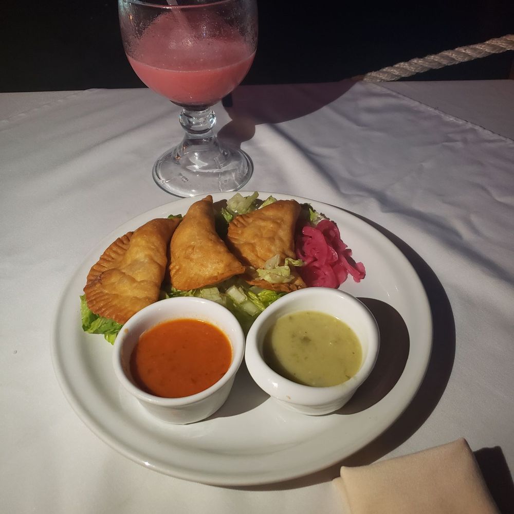 Muelle 7 - Shrimp or Fish mixed Empanadas. These are absolutely my favorite! I love the green sauce. - Cocktail Bars Near Me - Isla Mujeres, ROO Muelle 7 - Shrimp or Fish mixed Empanadas. These are absolutely my favorite! I love the green sauce. - Cocktail Bars Near Me - Isla Mujeres, ROO