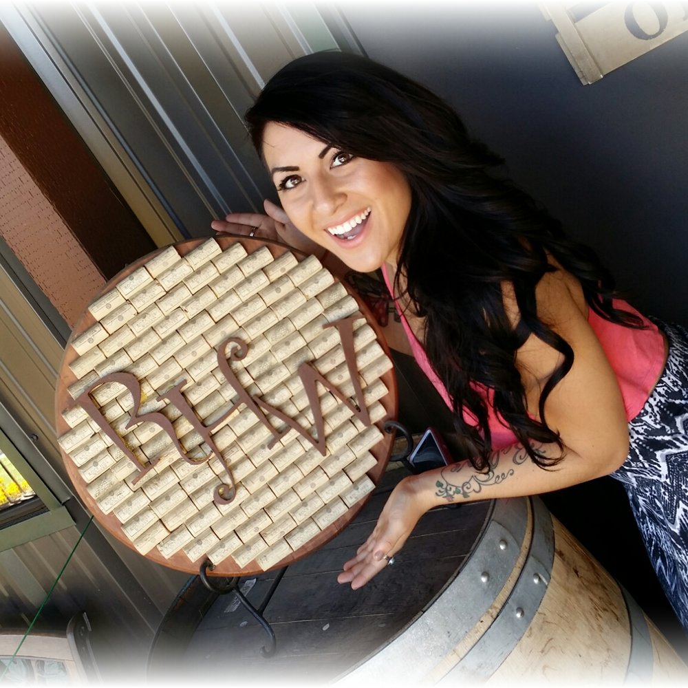 Rock Hill Winery - a woman holding a barrel of wine - Wineries Near Me - Loomis, California Rock Hill Winery - a woman holding a barrel of wine - Wineries Near Me - Loomis, California
