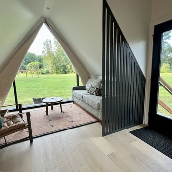 Outbound Stowe - Cabin interior looking towards the river and recreation path - Hotels Near Me - Stowe, Vermont