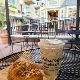 Almond croissant and iced vanilla latte Almond croissant and iced vanilla latte