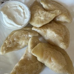 Sandy's Ukranian Kitchen - Delicious pierogies with sour cream