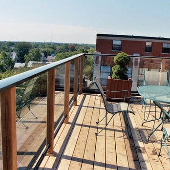 Punch Construction - Deck with glass railings in Chicago by Punch Construction. - General Contractors Near Me - Chicago, Illinois Punch Construction - Deck with glass railings in Chicago by Punch Construction. - General Contractors Near Me - Chicago, Illinois