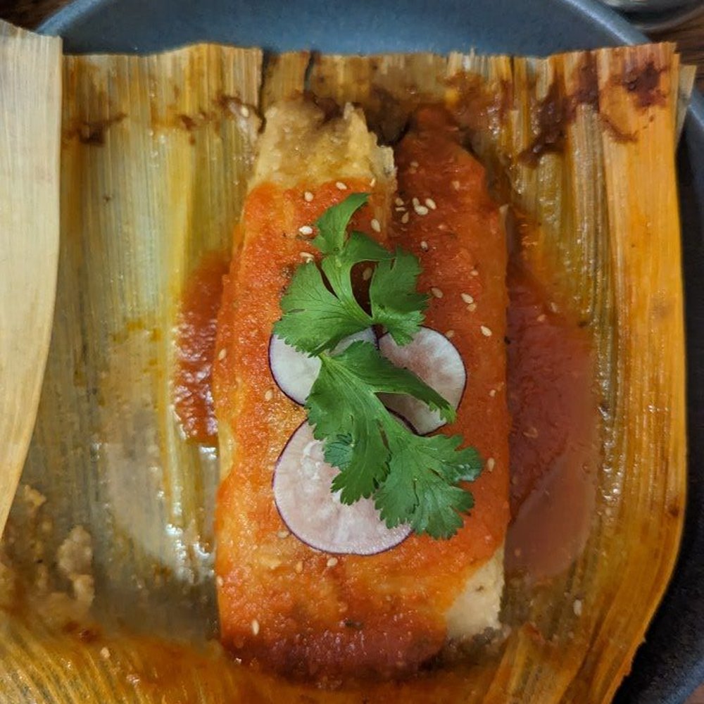 Corazon Comedor - Tamale, pork in mole de Oya. - Mexican Near Me - Santa Barbara, California Corazon Comedor - Tamale, pork in mole de Oya. - Mexican Near Me - Santa Barbara, California