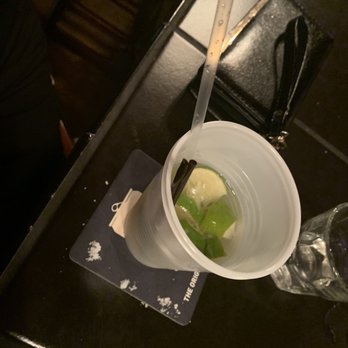 Zoo Tavern - a plastic cup of ice cream and a pair of scissors - Nightlife Near Me - Lilburn, Georgia